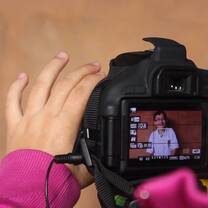 an image of a hand holding a camera