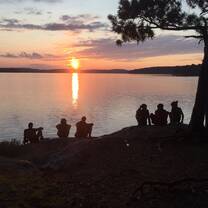 People watching sunset by the lake.