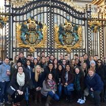 group of people in front of the big gate