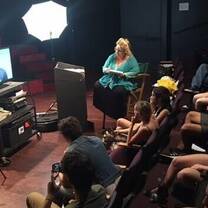 group of people inside the room watching a movie
