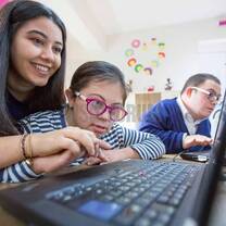 Two girl using laptop
