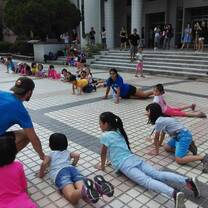 male camp counselor with children