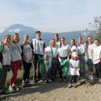 Visit the French Alps in Grenoble with API!  group of students in white t-shirts in front of mountain