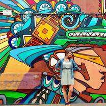 girl next to a grafitti wall 