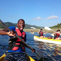 Male student on a kayak living his best life in Cape Town 