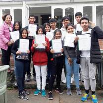 group of students showing off their certificates