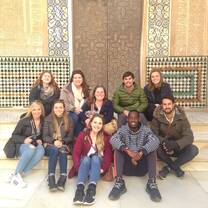 men and women sitting on the floor