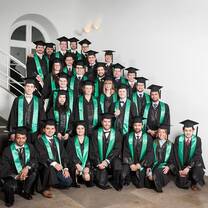 group of picture wearing their graduation dress and hat