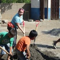 Kids are helping in mixing the cement