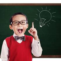 cute little boy wearing red vest with bow tie and eyeglasses