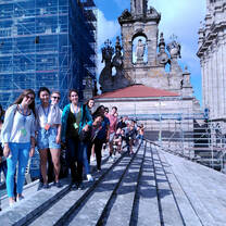 group of people in front of a huge church