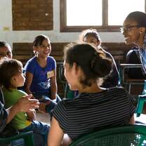 Two ladies talking to the children