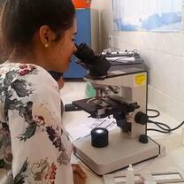 female with microscope 