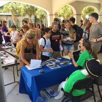 Students at a fair registration.