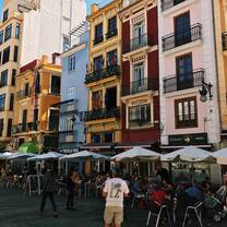 red and blue apartment buildings in Spain