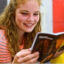 young lady reading a book