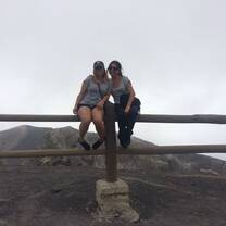 Two girls sitting on the fence