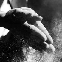 hands holding a sand 