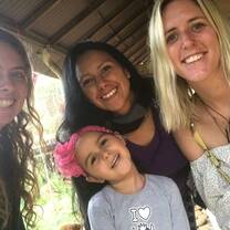 4 ladies and a little girl smiling