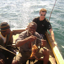 three men boating and fishing