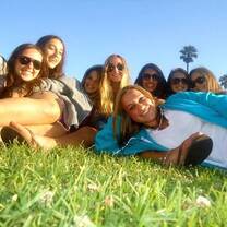 girls lying on the grass