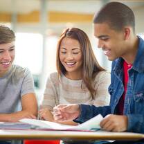three people reading something