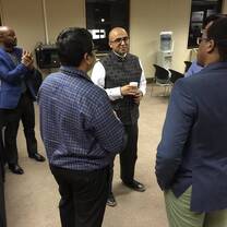 group of men talking to each other