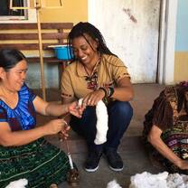 Medical Fellow learning to thread cotton