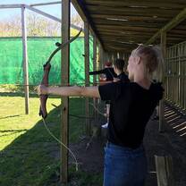 girl is holding a bow and arrow