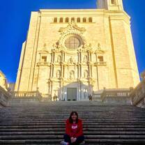The girl sitting at the stairs