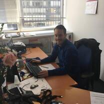 guy sitting on his chair while doing work