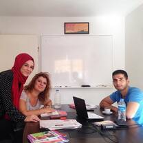 2 girls and one guy looks like they are doing their work