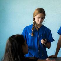 Participant taking vital signs in Belizean health clinic. 