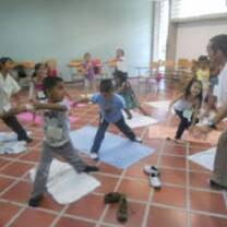 The guy teaching the kids something productive