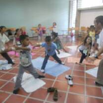 The guy teaching the kids something productive