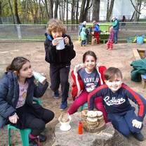 kids sitting under the tree 
