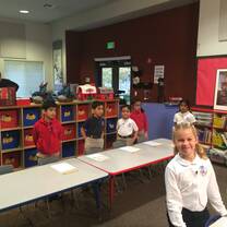 Kindergartners inside a classroom.