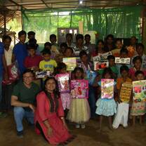 children showing the gifts given to them