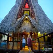 two girls outside the nipa hut