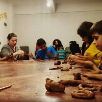 kids are doing different things in mud clay