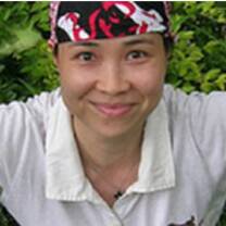 woman wearing white shirt and red hanky in her head