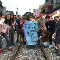 standing on railroad tracks holding the sky lantern we all had just painted and written on