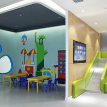 kids school with painted walls and small tables and chairs