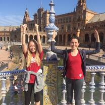 Holding up the IU fists and blades pose in front of the plaza de Espana.