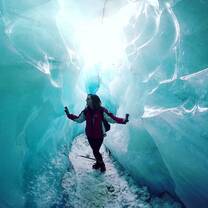 student walking through a glacier
