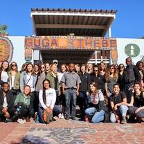 group in front of old building 