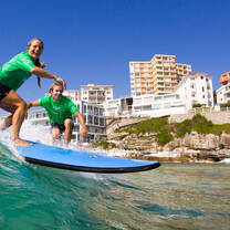 man surfing riding a wave