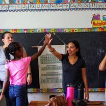 girl high fiving