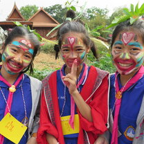 three girls with painted faces in Thailand