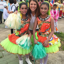 two students smiling in Thailand with teacher